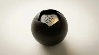 OpenAI's first hardware device is a screenless, camera-equipped smart speaker with 'mechanical elements that can move on their own' to connect with users on a 'humanlike level,' arriving in 2027 as part of a ~5-device lineup designed with Jony Ive